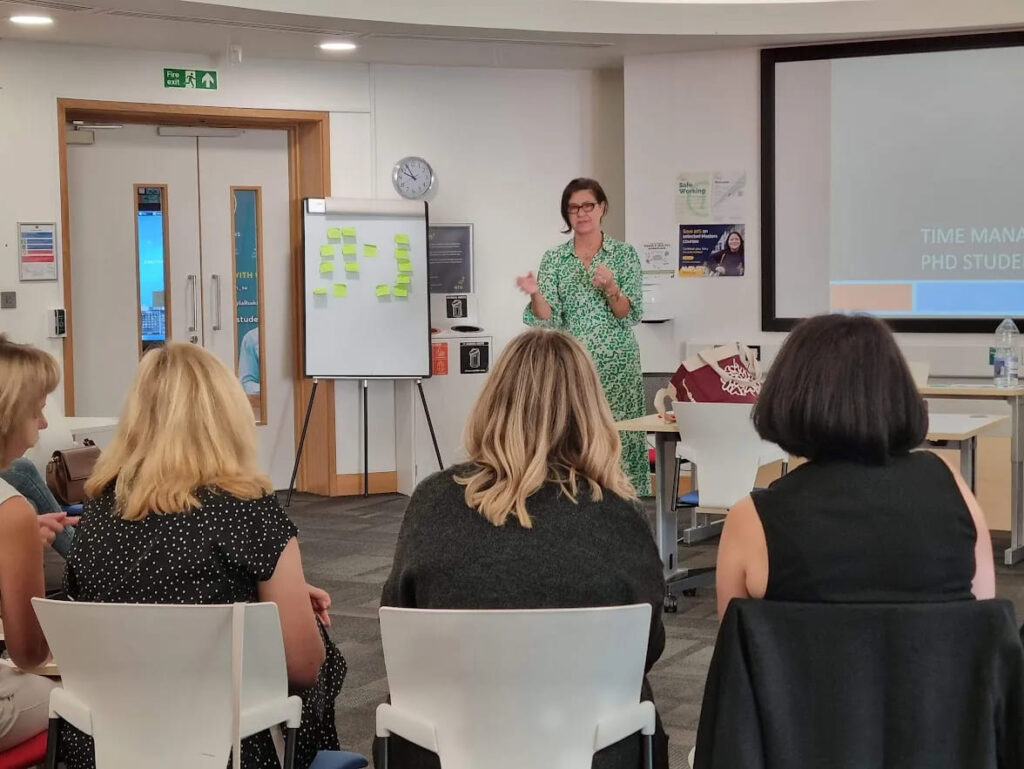 Workshop leader presenting to a group of doctoral supervisors during a TEDS training session.