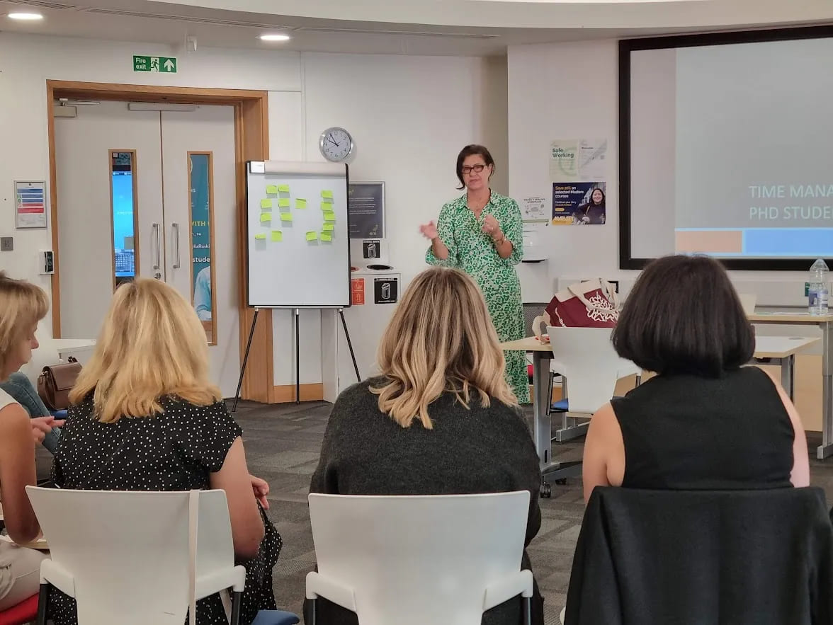 Workshop leader presenting to a group of doctoral supervisors during a TEDS training session.