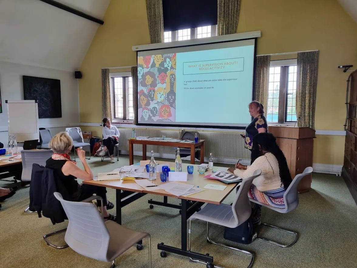 Illustration of doctoral supervisors and students collaborating, symbolising leadership and academic mentoring.